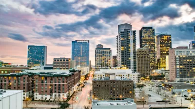 Colorful high-saturation view of downtown Houston, Texas with pink and blue dusk sky
