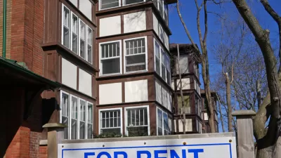 Brick apartment building with For Rent sign