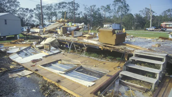 A destroyed mobile home after Hurricane Andrew. Only the concrete steps remain. 