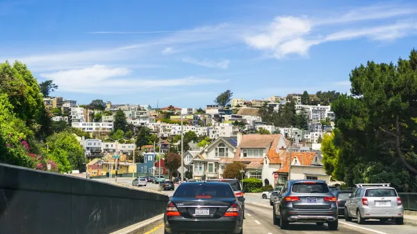 Cars driving into a residential neighborhood in San Fransisco.