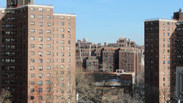 High-rise red brick public housing buildings in New York City.