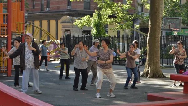 Group of seniors doing tai chi in park in New York City.