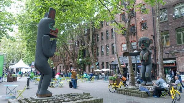 Two large totem-style sculptures in Pioneer Square plana in Seattle, Washington.