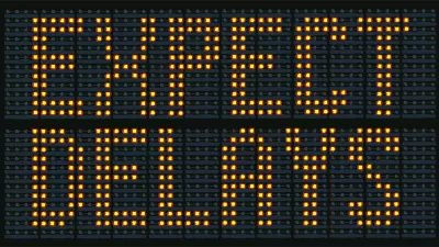 Yellow on black "Expect Delays" traffic sign