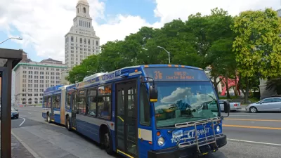 Blue CT Transit bus in Hartford, Connecticut with state capitol building in background
