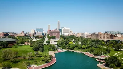 Aerial view of downtown Omaha, Nebraska with lake in foreground