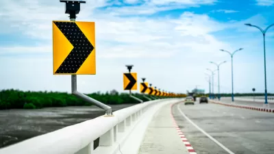Close-up of curve ahead sign on highway