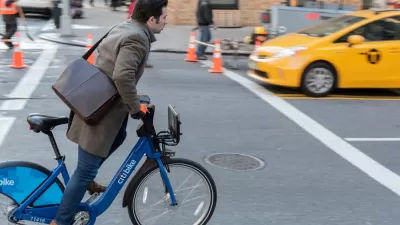 Man with leather messenger bag riding CitiBike bike on New York street