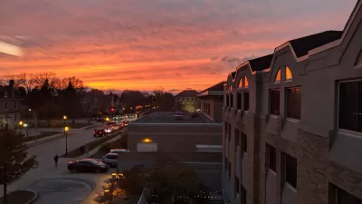 Suburban houses against colorful sunset sky in Waukesha, Wisconsin