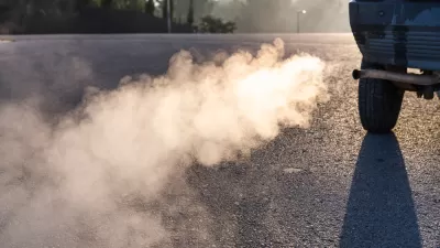 Close-up of car tailpipe emitting smoke