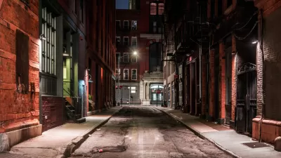 View down New York City alleyway at nighttime