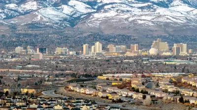 Aerial view of Reno, Nevada against snow-capped mountains in winter