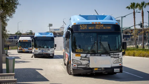 White Anaheim public transit bus on street.
