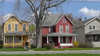 Old houses with large porch and colorful siding