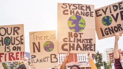 Close-up of signs being held up at climate change protest