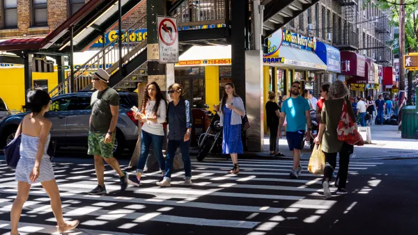 Crowd crossing the street in Astoria, Queens.