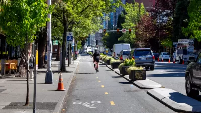 Two-way bike lane in downtown Seattle, Washington protected wtih concrete curbs