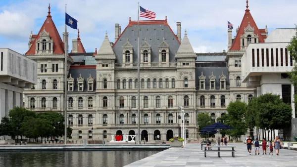 State capitol building in Albany, NY with two matching red pointed towers.
