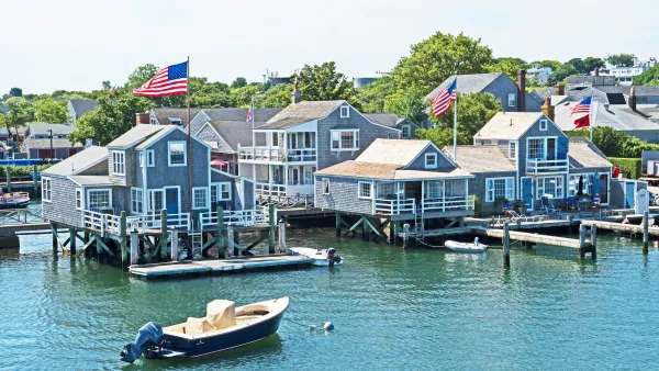 Grey/blue wood homes on docks in Nantucket, Massachusetts.
