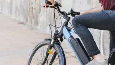 Close-up of person sitting on electric bike