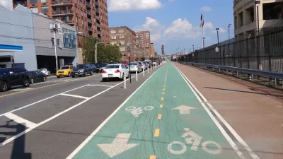 Green painted bike lane with delineators in Hoboken, New Jersey
