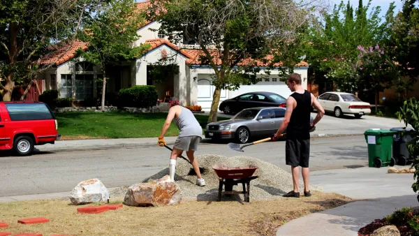 Two men working on a xeriscaped garden