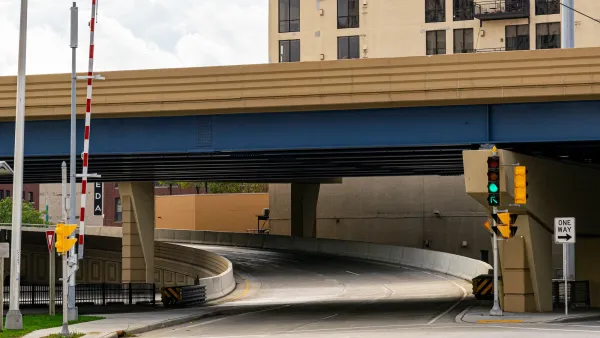 Elevated freeway segment with stoplight at underpass in Milwaukee, Wisconsin.