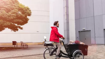 Man riding cargo bike with large front carrier