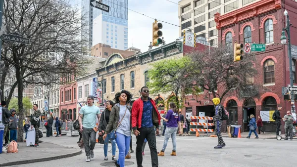 People walking on Sixth Street in Austin, Texas.