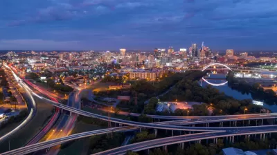 Pink light before morning dawn sun reflects on clouds over downtown Nashville TN