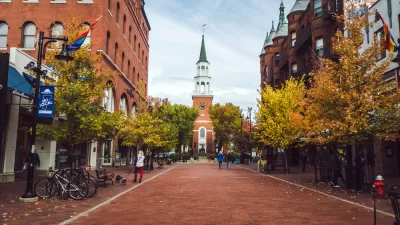 View down brick street in Burlington, Vermont with church at end