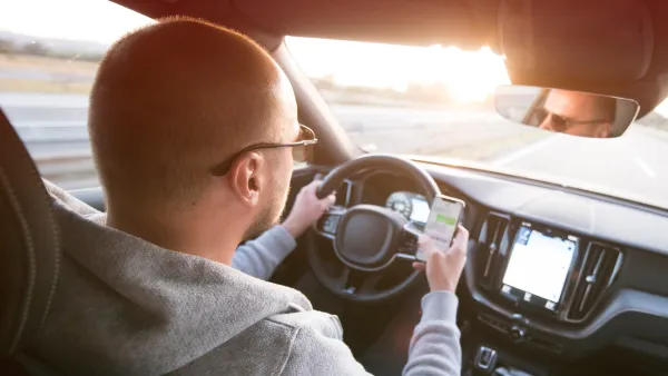 Man driving while texting