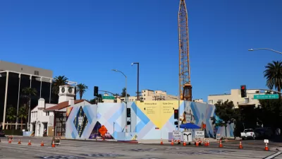Construction fence and crane