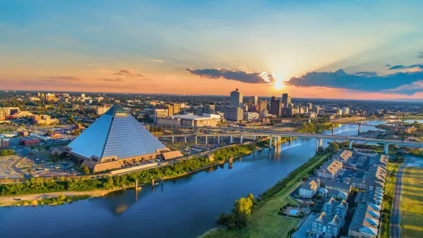 Skyline of Memships, Tennessee at sunset with glass pyramid in foreground.