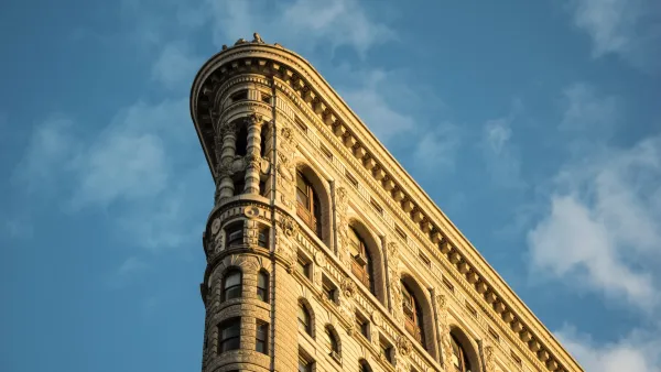 Close-up on top corner of Flatiron Building at golden hour.