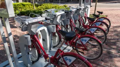 Docked BCycle bike share station in Houston with red bikes