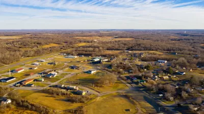 Aerial view of small rural community in Kentucky with ild rolling hills and sparse development