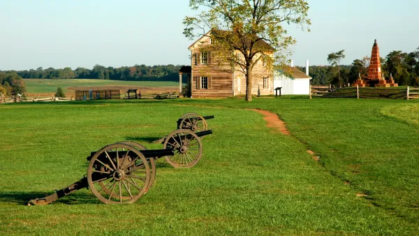 Civil War-era cannons and two-story wood building at Manassas National Battlefield Civil War historic site.