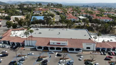 Aerial view of large store with parking and houses with beach in background in Rancho Penasquitos, California