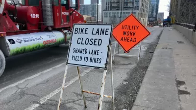 "Bike Lane Closed" and "Utility Work Ahead" signs on Chicago bike lane