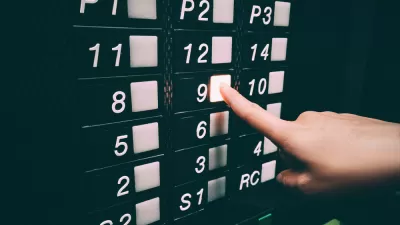 Close-up of black elevator panel qith square white buttons missing 13th floor, person pushing floor 9