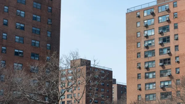 Red brick high-rise public housing buildings in Queens, New York City.