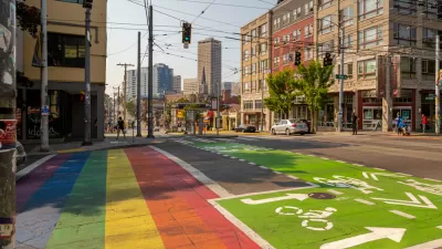 Rainbow painted crosswalk next to green painted bike lane on Seattle, Washington street