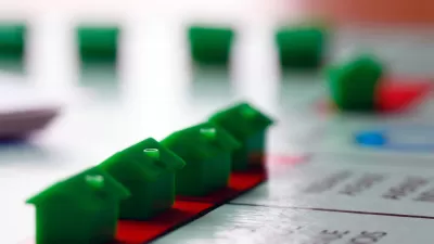 Green Monopoly houses on game board