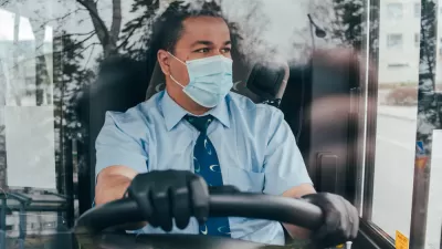 Bus driver wearing a COVID-19 protective mask