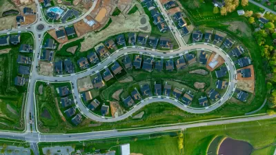 Aerial overhead view of single-family neighborhood with some houses under construction