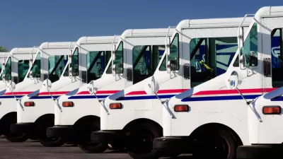A row of USPS delivery trucks