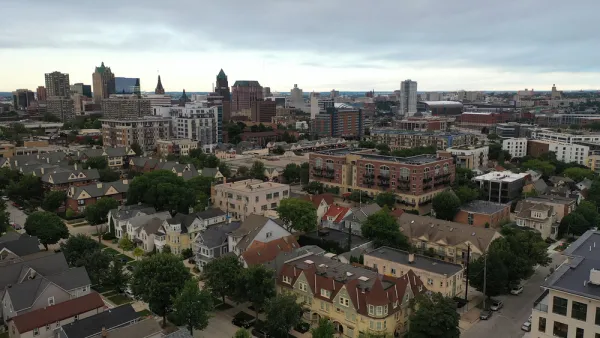 Aerial view of Milwaukee, Wisconsin skyline with large old homes in the foreground