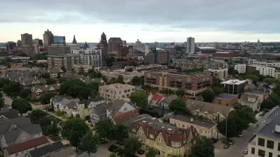 Aerial view of Milwaukee, Wisconsin skyline with large old homes in the foreground