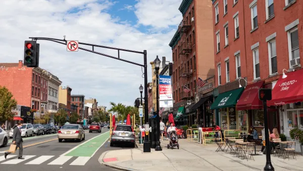 Crosswalk on street with green bike lane in Hoboken, New Jersey.